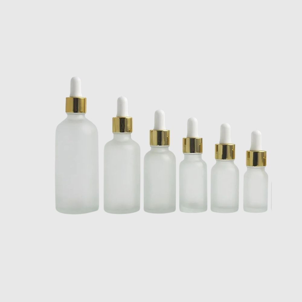 Staklena boca pjeskarena sa zlatno-bijelom pipetom