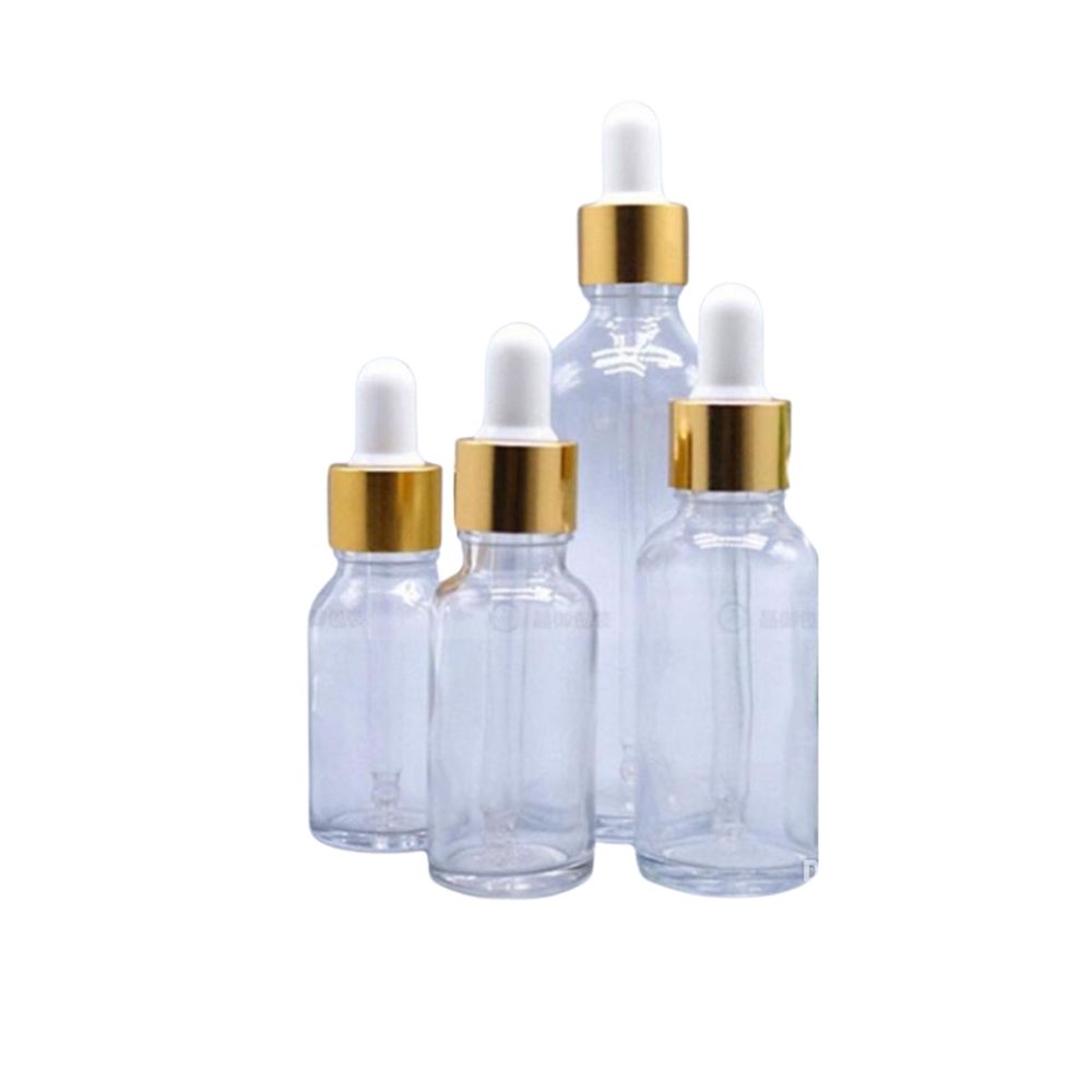 Staklena boca transparentna sa zlatno-bijelom pipetom